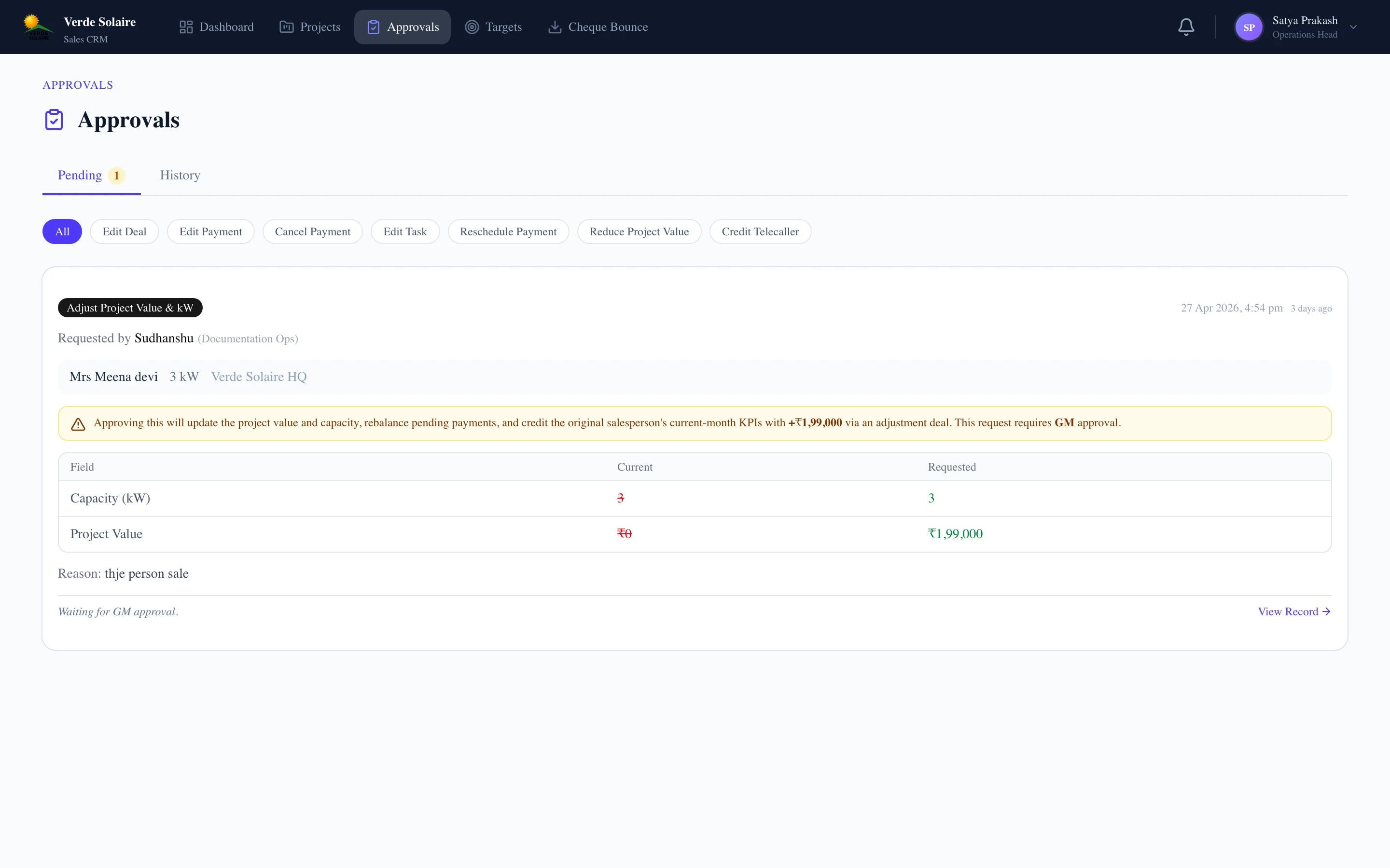 Spine approvals queue — a pending request to adjust a project's capacity (kW) and value, showing the requester, the current vs requested values, the impact on KPIs, and an inline warning explaining what approving will change.